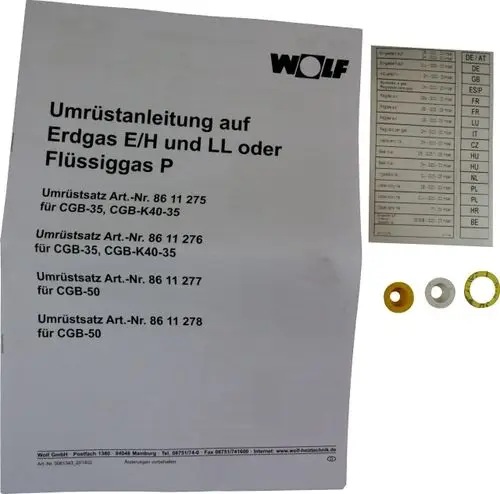 Wolf Umrüstsatz mit Montageanleitung für den Wechsel von Erdgas auf Flüssiggas, einschließlich verschiedenfarbiger Ringe für unterschiedliche Modelle.